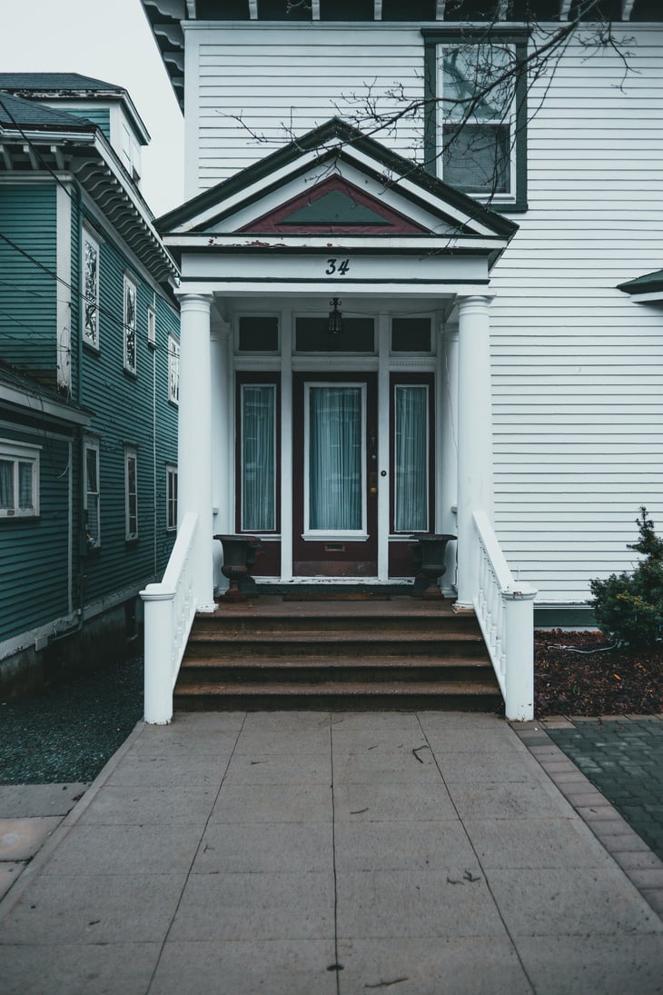 Exterior of entrance to residential house with small stairs